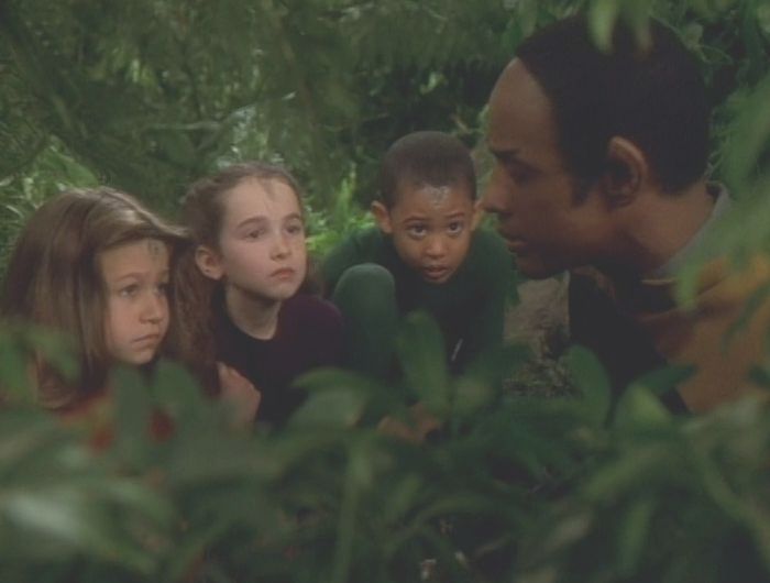 Tuvok with the children hiding in the forest