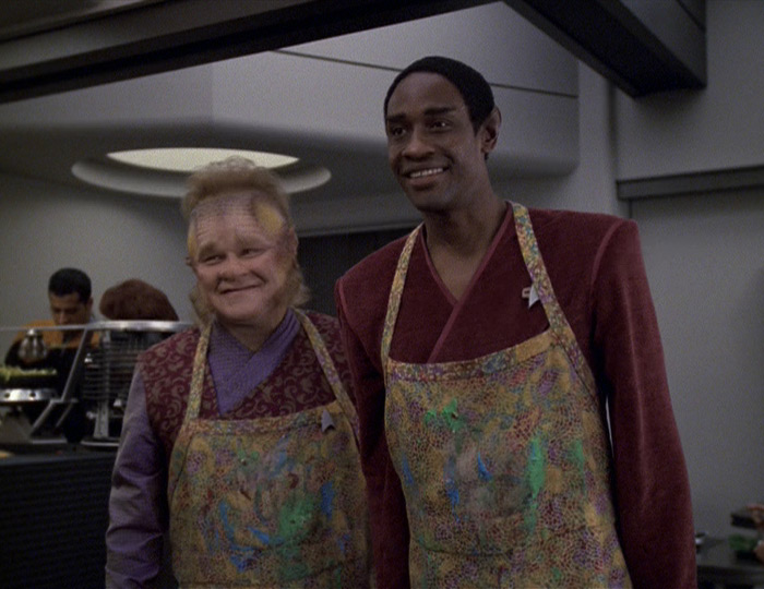 Neelix and Tuvok smiling in aprons