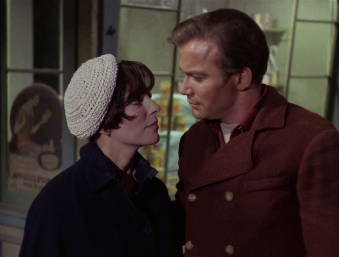 Kirk and Edith look lovingly at each other