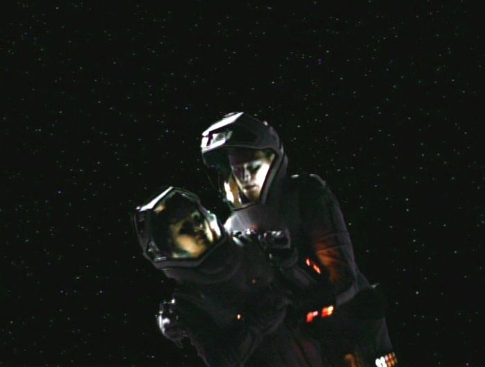 Tom and B'Elanna floating in space in spacesuits