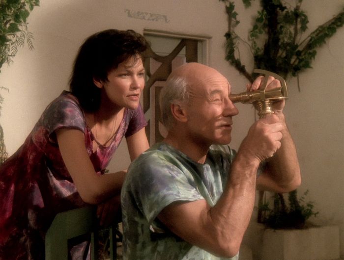 Picard checks the position of the sun as Eline looks on