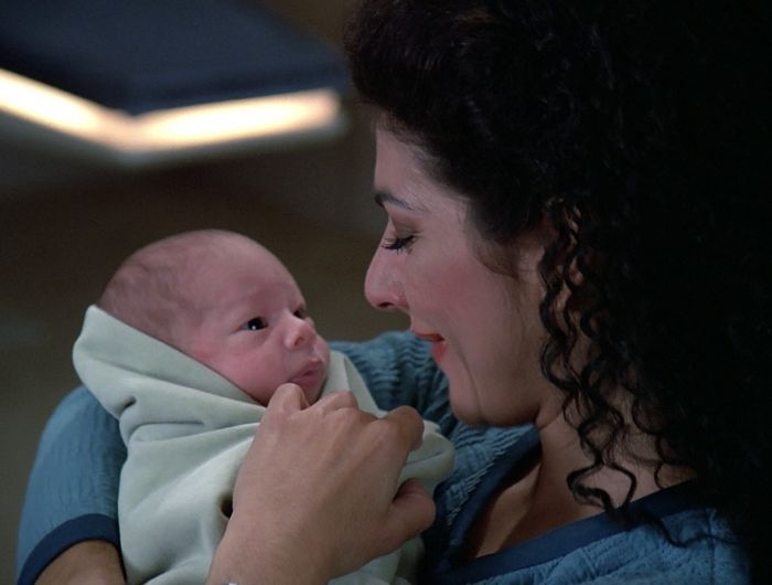 Troi holding newborn Ian